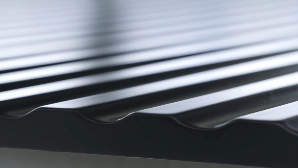 Close up view of black roofing waterproof material, construction and building concept. Action. The